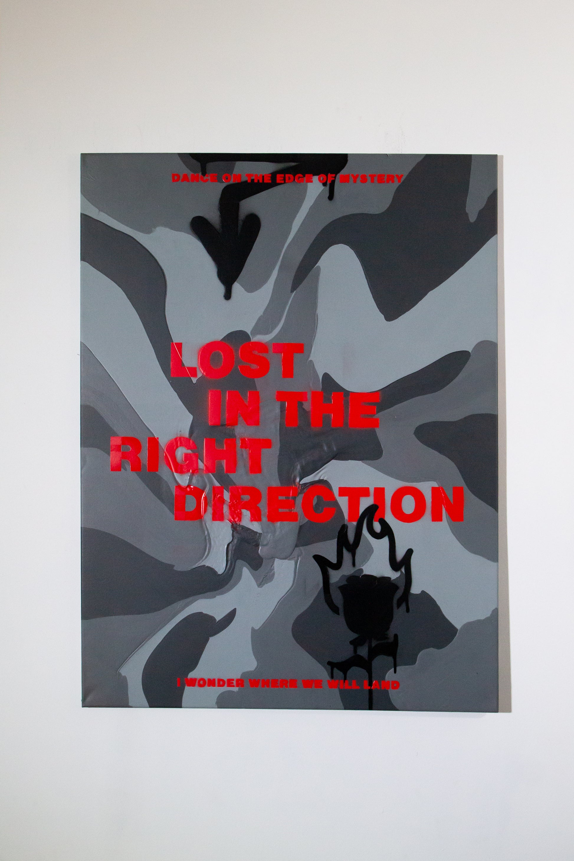 painting with red typography design and on a  abstract camouflage gray background and black streetart design